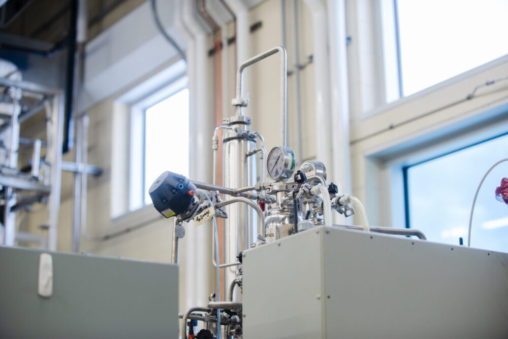 "A close-up image showing a sterile filter attached to the top port of a stainless steel laboratory fermentor or bioreactor."